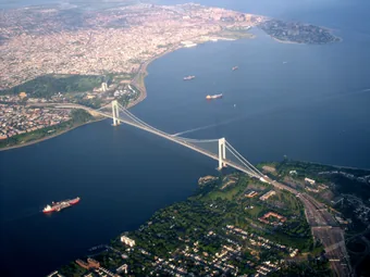 Aerial view of the Verrazzano-Narrows Bridge
                        spanning the entrance to New York Harbor
                        between Brooklyn and Staten Island.